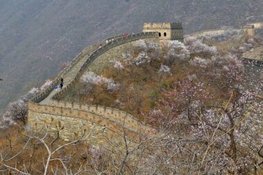 No educational travel adventure would be complete without a Journey along the Great Wall of China, an Ancient Wonder of the World - TravelingInHeels.com