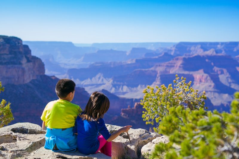 Teach your kids to love the outdoors with hikes when camping with family. 
