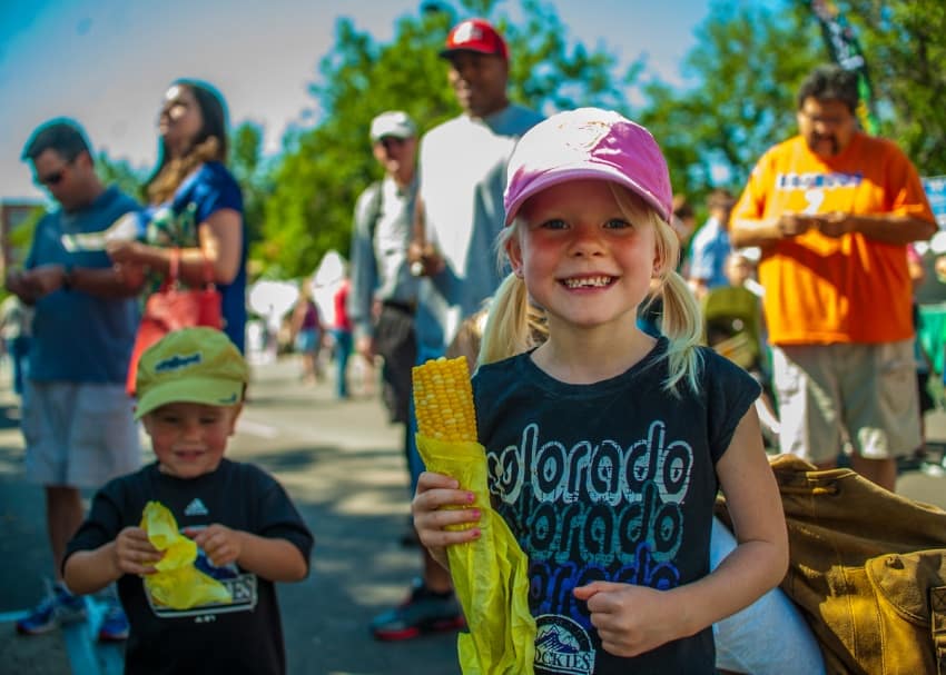 Children eating corn on the cob during Taste of Colorado festival Photo credit: Evan Semon and VISIT DENVER