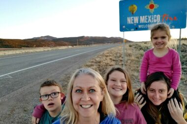 Family road trip tips include stopping to take photos of all the state line signs.