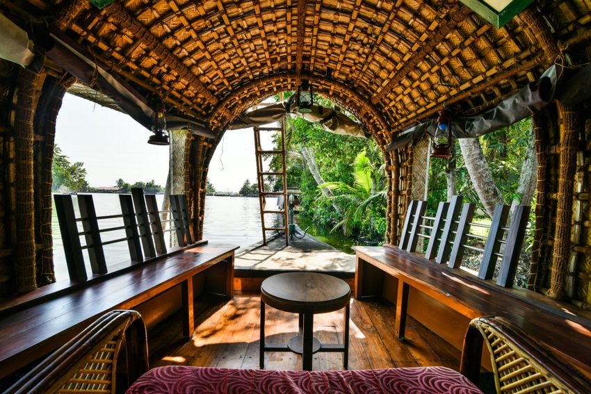 Rent a houseboat and cruise the backwaters of Kerala, India.