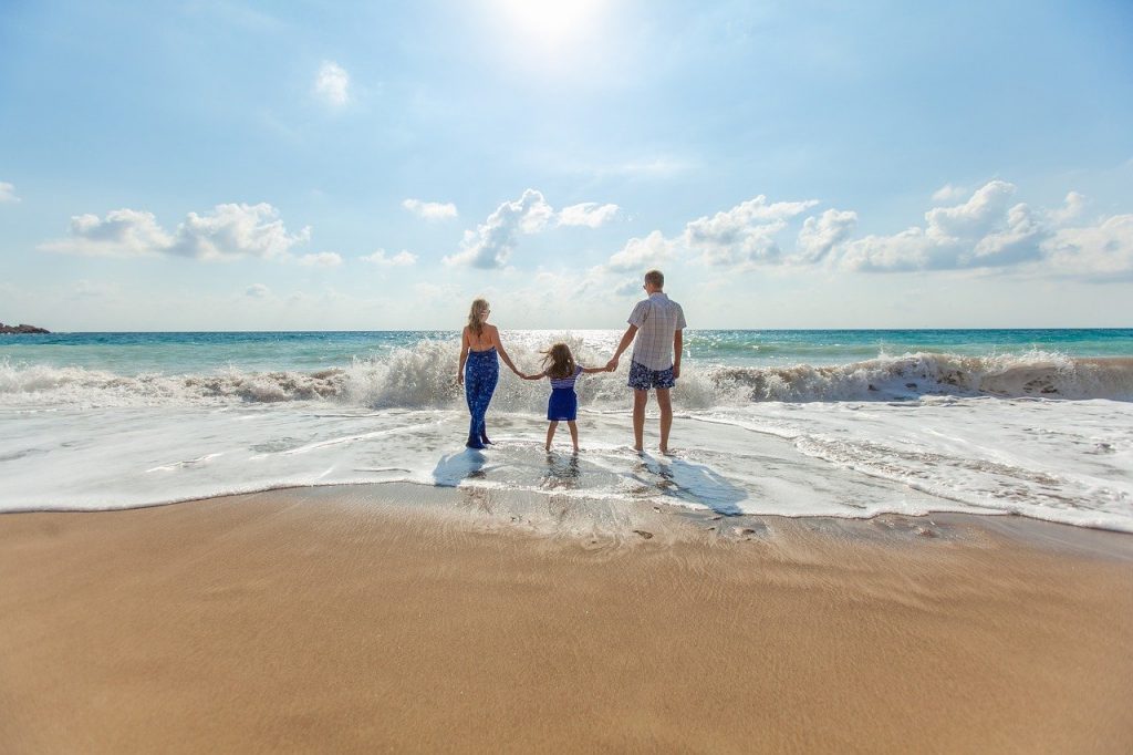 Take a walk on the beach during your island family vacation.