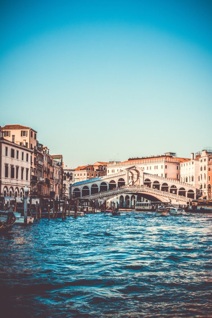 A romantic walk across the Ponte dell’Accademia (Accademia Bridge) across the Grand Canal in Venice, Italy.