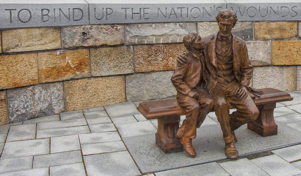The United States Historical Society commissioned the bronze life-sized statue and donated it to the National Park Service. It is located at the Tredegar site of the Civil War Visitor Center in Richmond, Virginia, where the President came in peace "to bind up the nation's wounds" at the end of the Civil War.