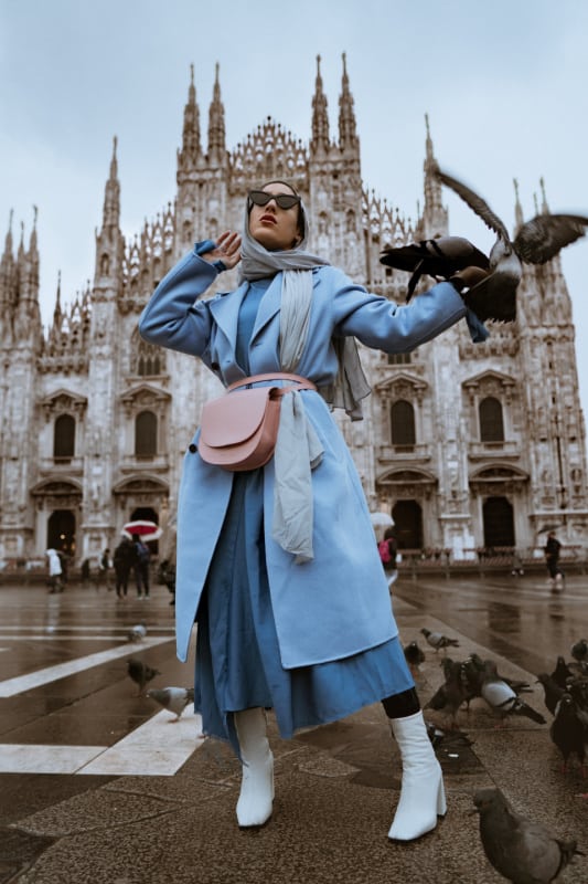 Traveling for fashion includes planning trips to visit Fashion Week, such as in Milan, Italy. 