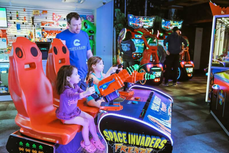 Family adventure travel activities at an arcade